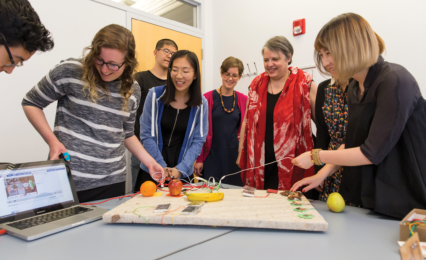 students using fruit to build battery
